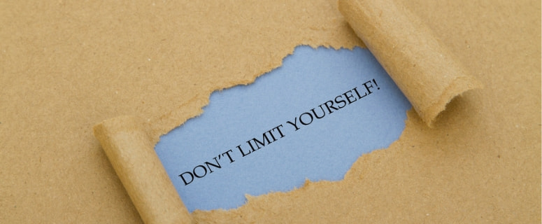 Torn paper revealing a blue background with the motivational phrase "DON'T LIMIT YOURSELF!" emphasizing the importance of overcoming barriers, relevant to plumbing and heating maintenance.