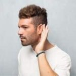 Profile view of a young man with a stylish haircut, listening attentively for Force Plumbing and Heating LLC.