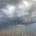 Dark stormy clouds with rain, highlighting plumbing issues during the rainy season for Force Plumbing and Heating LLC.
