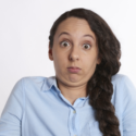 Person with a confused expression, wearing a light blue shirt, illustrating the challenges of plumbing emergencies and home maintenance discussions.