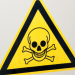Toxic warning sign with skull and crossbones; relevant for emergency plumbing by Force Plumbing and Heating LLC.