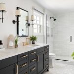 Modern bathroom with dual sinks, sleek vanity, and shower area by Force Plumbing and Heating LLC.
