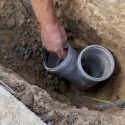 Plumbing contractor working on sewer line repair in Red Bank, NJ